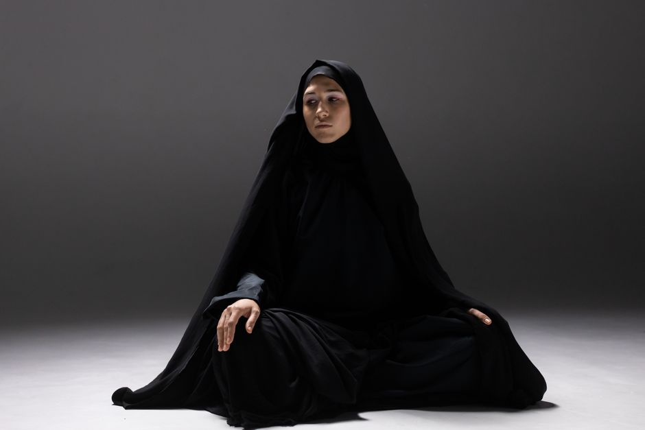 Studio portrait of a woman in traditional attire, showcasing cultural elegance.